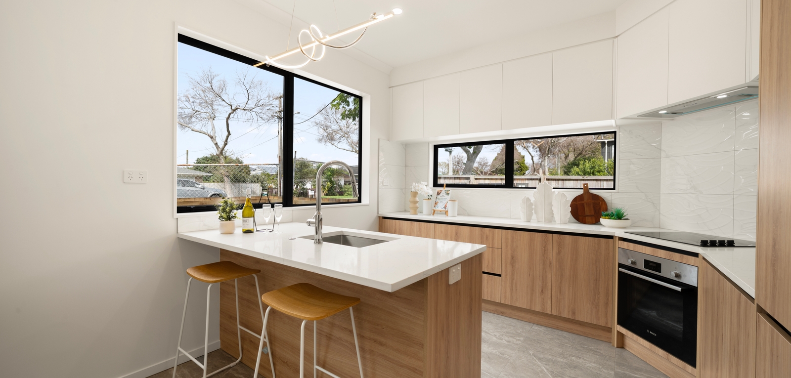 Kitchen with timber joinery and island bench