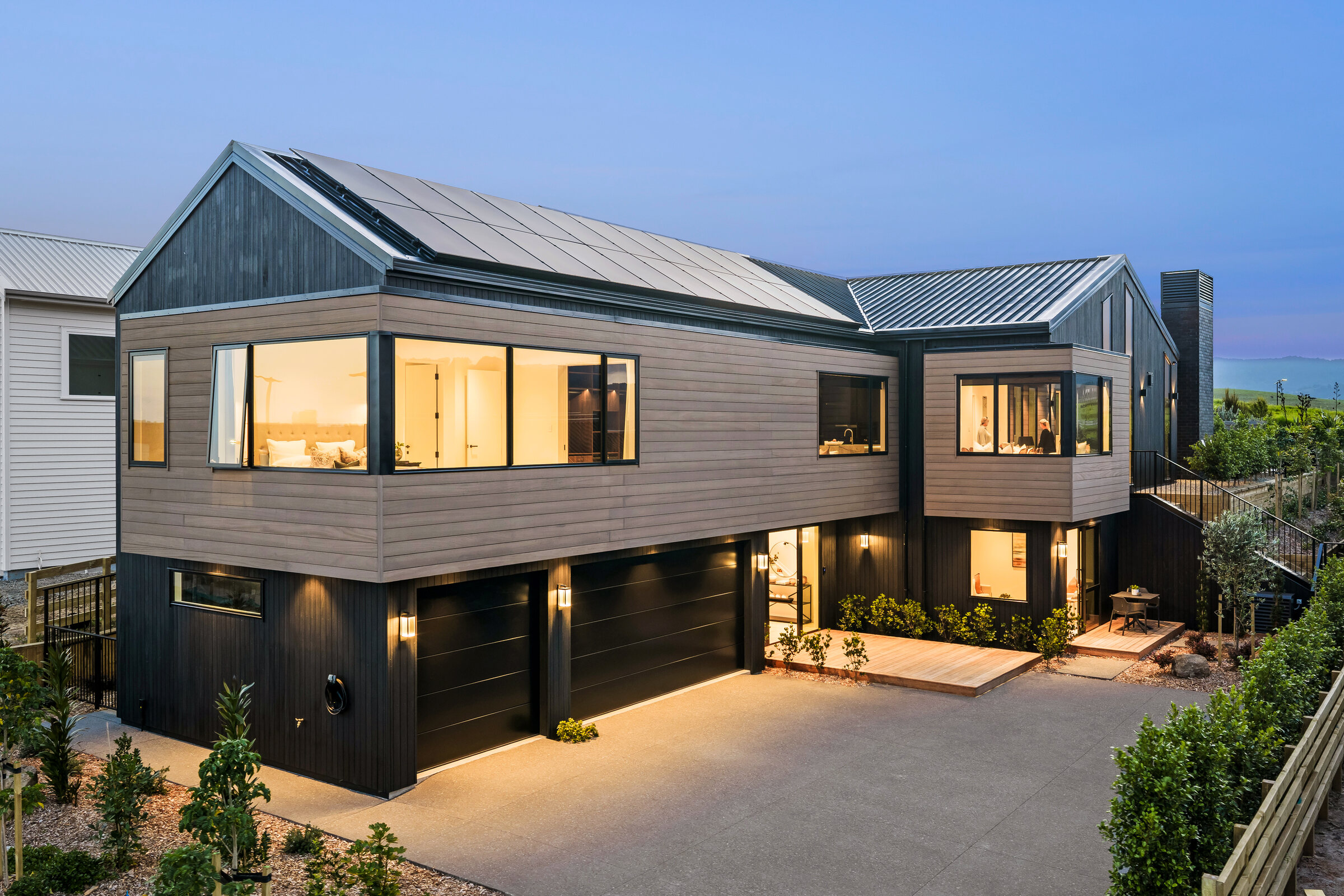 Poolside elevation of 25 Penney Rise at dusk