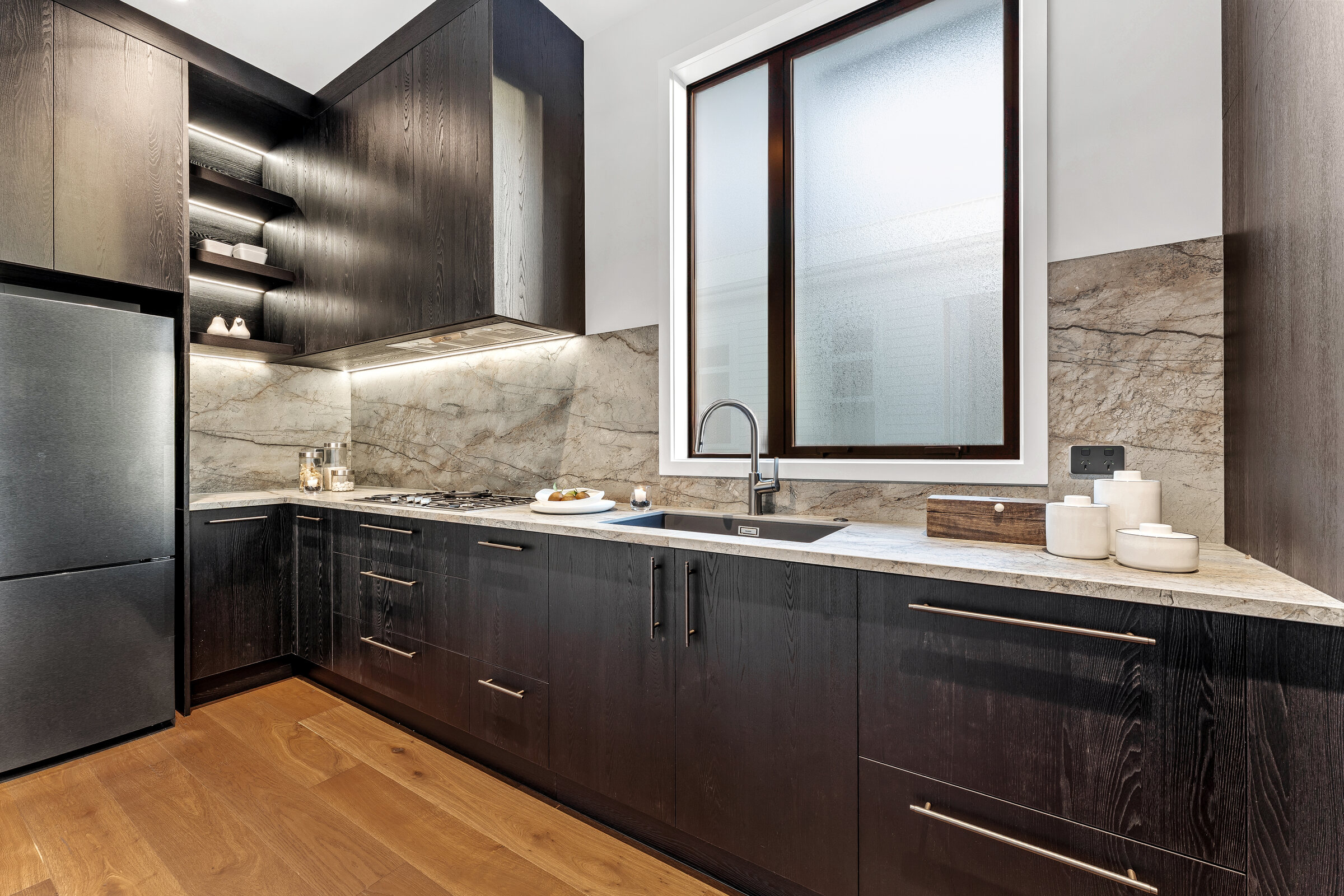 Kitchen detail with honed stone splashback