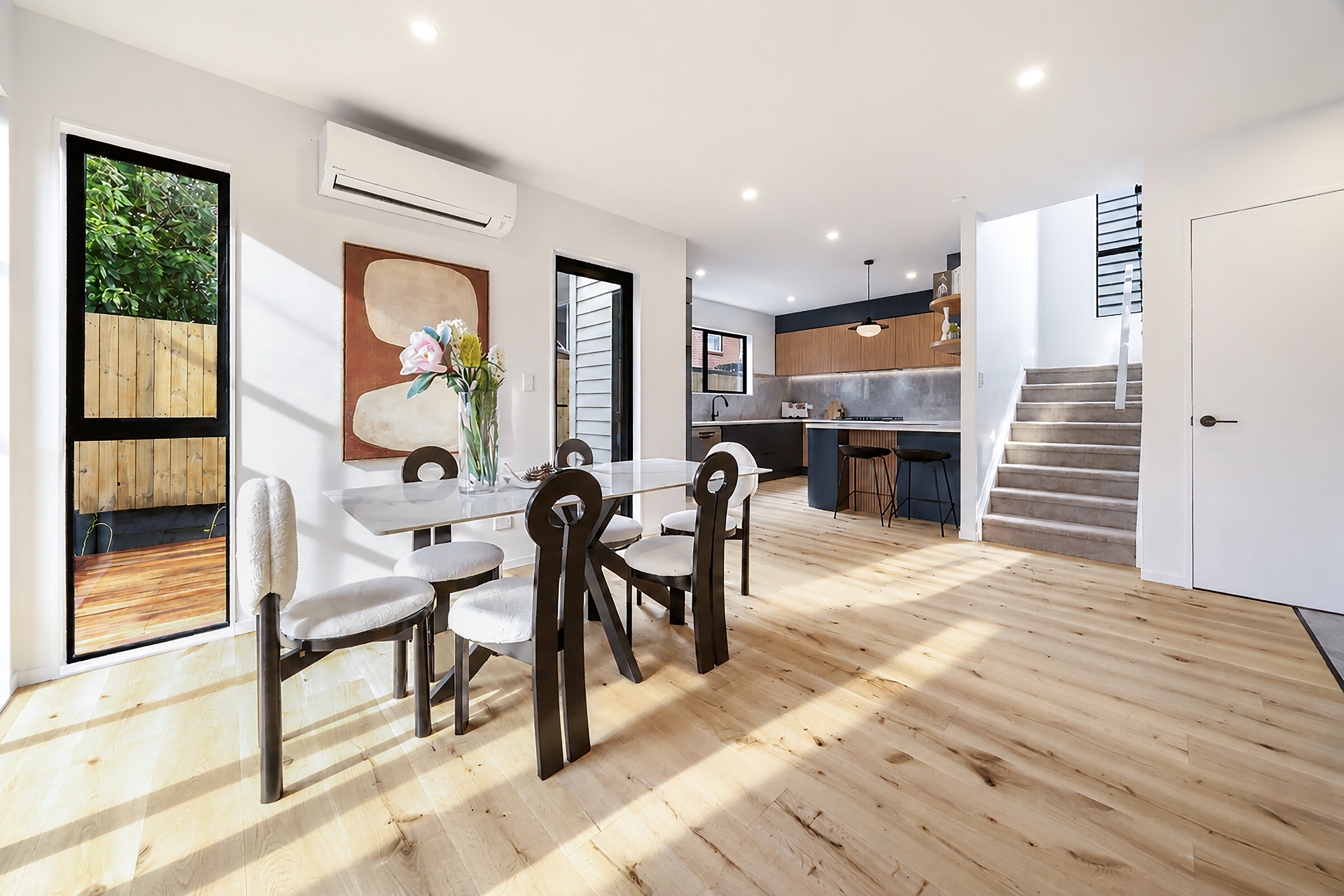 Open-plan dining and living area at 387 Albany Highway