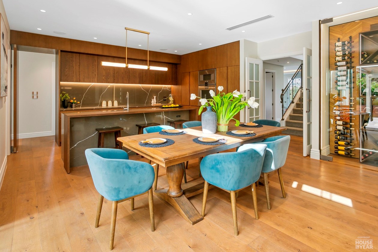 Kitchen and dining space with timber cabinetry