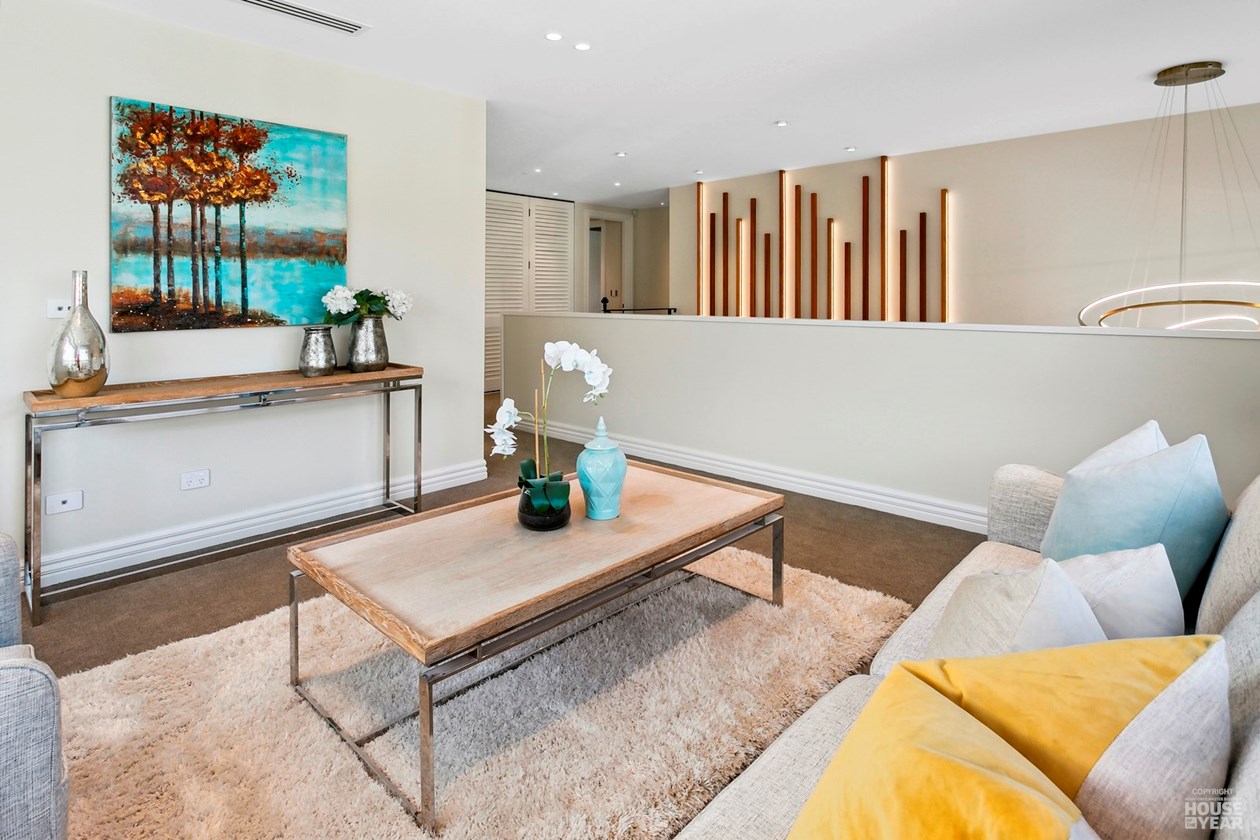 Family sitting room with timber screen and stair detail