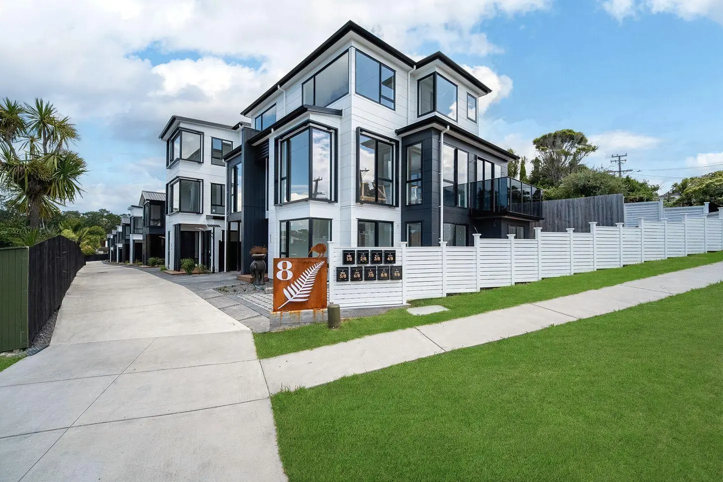 Daylight view of the shared entrance and standalone homes at 8 Park Rise