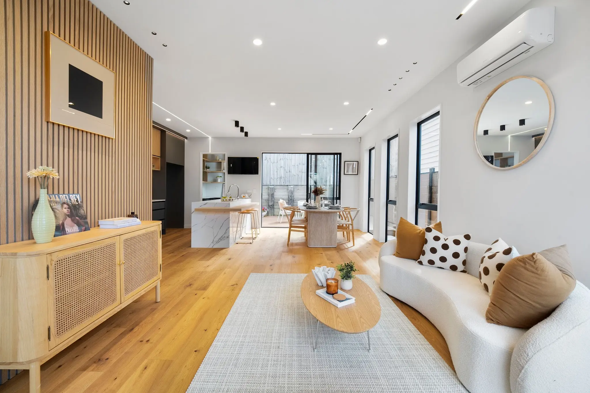Light-filled living area connecting to the kitchen and dining space