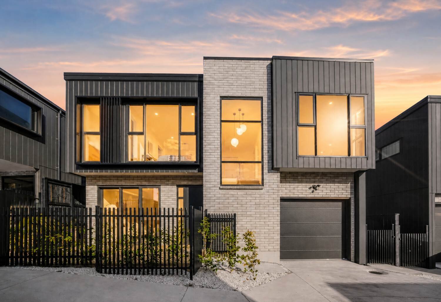 Twilight view of a completed home at 10 Agathis Avenue
