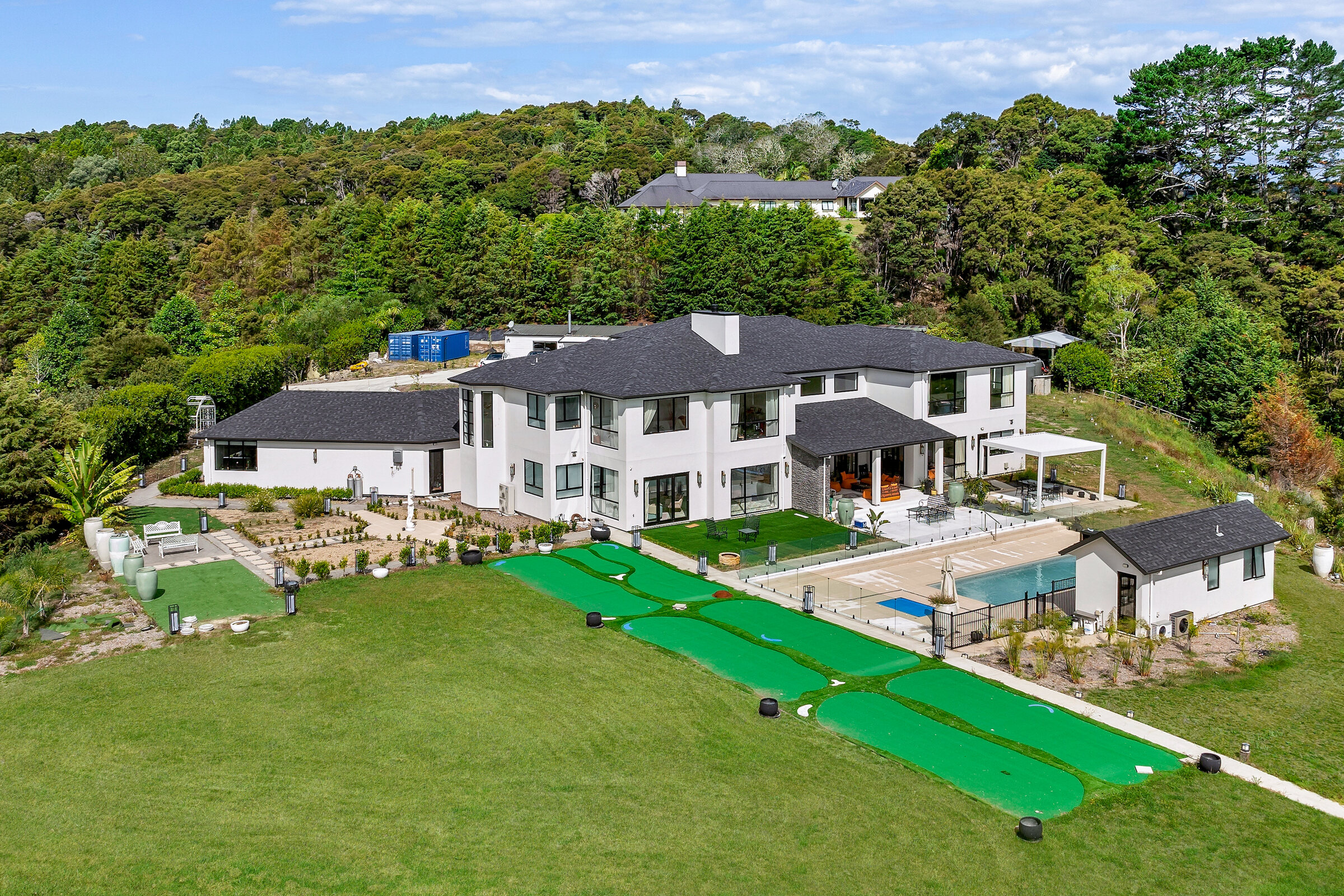 Aerial view of the residence, pool and landscaped grounds