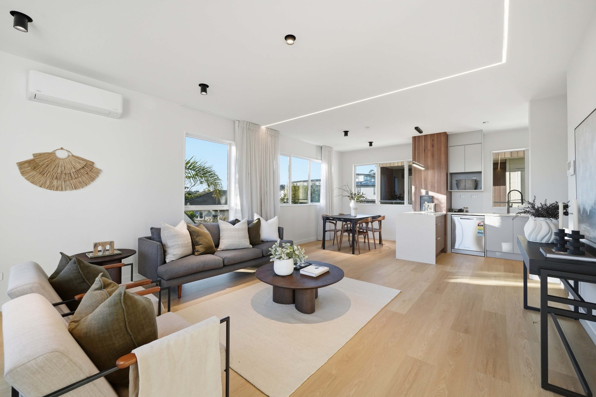 Open-plan living, dining and kitchen within a Corrella Road home