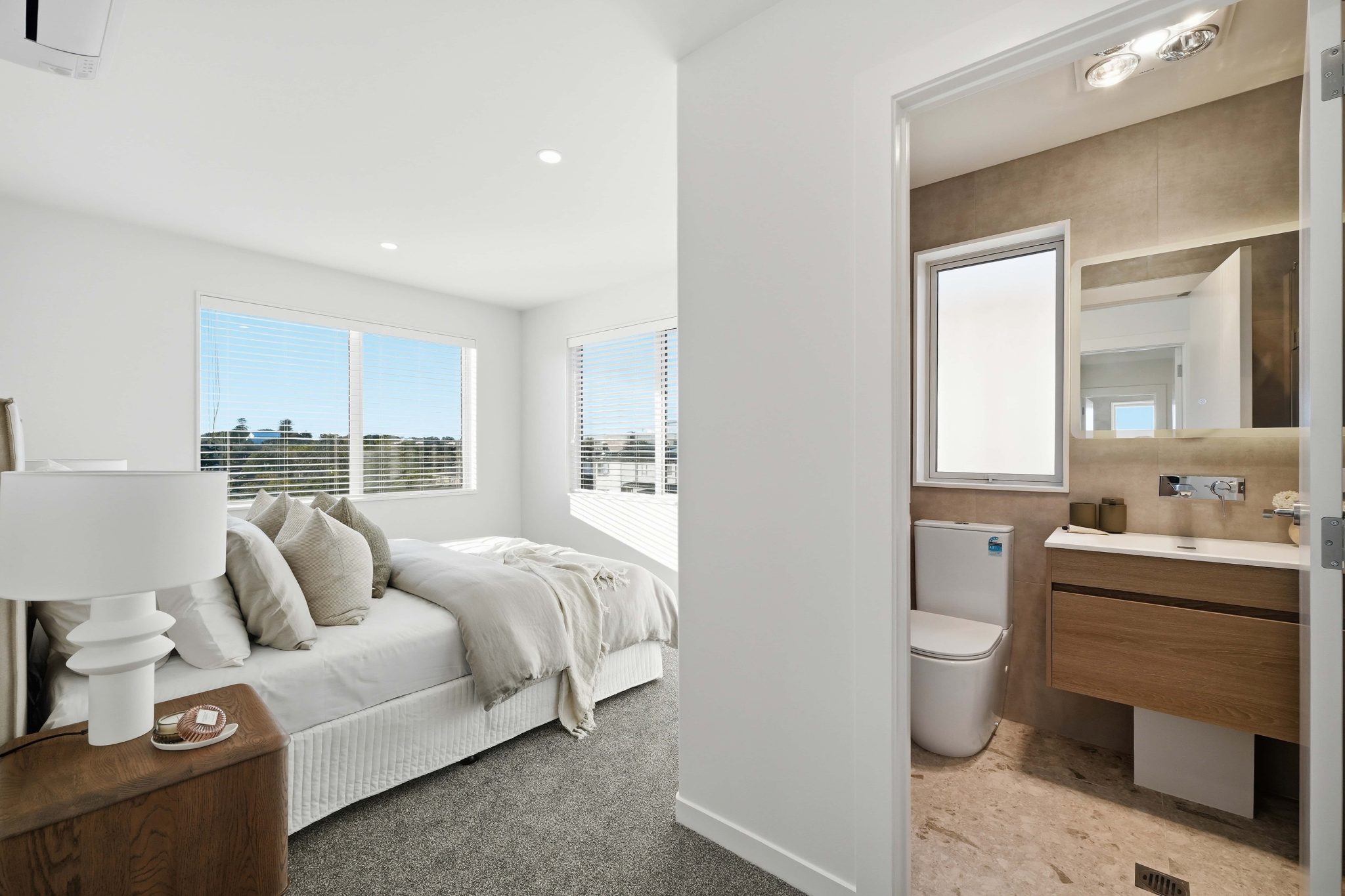Bedroom and ensuite with views over the neighbourhood