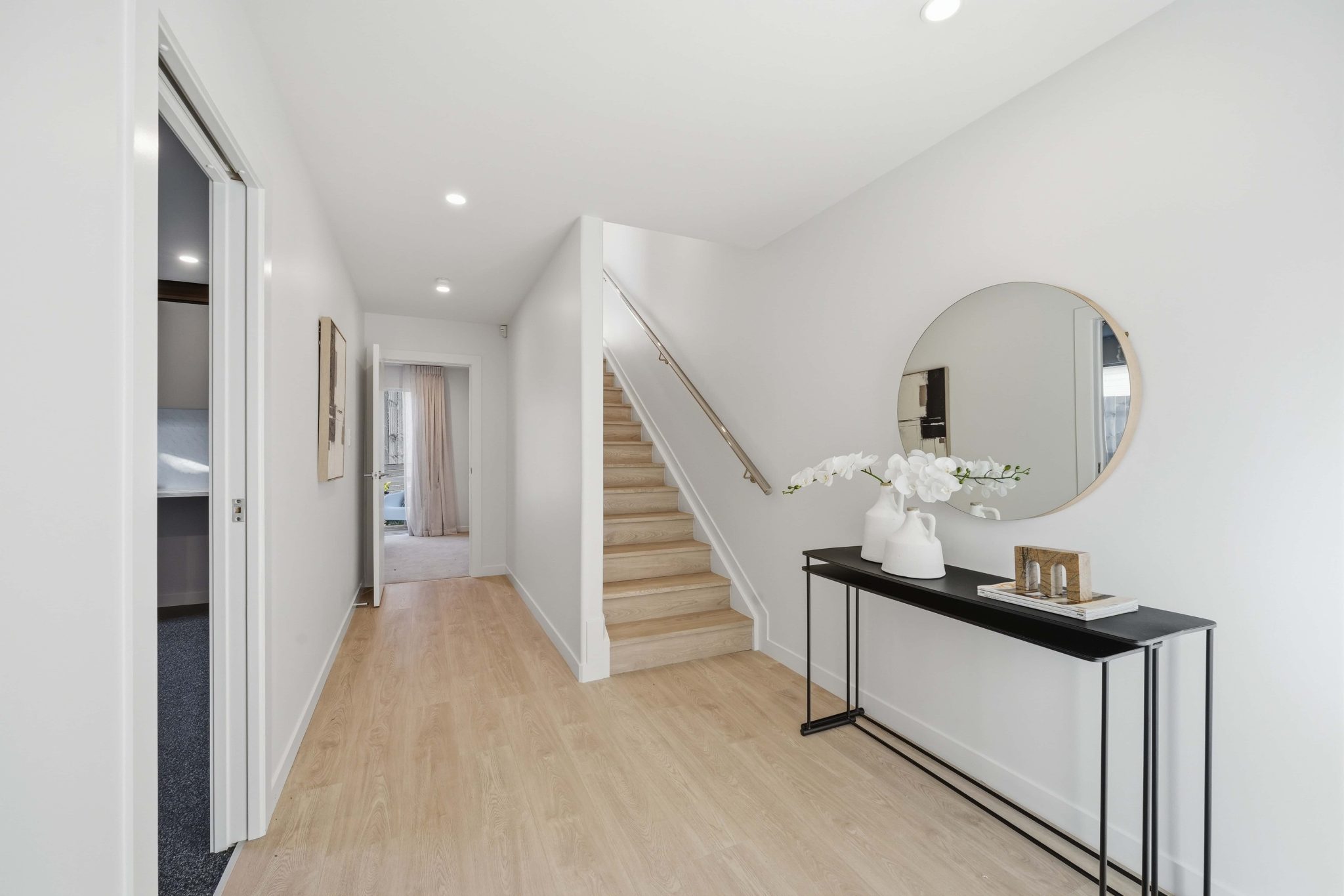 Entry hall and staircase with timber flooring
