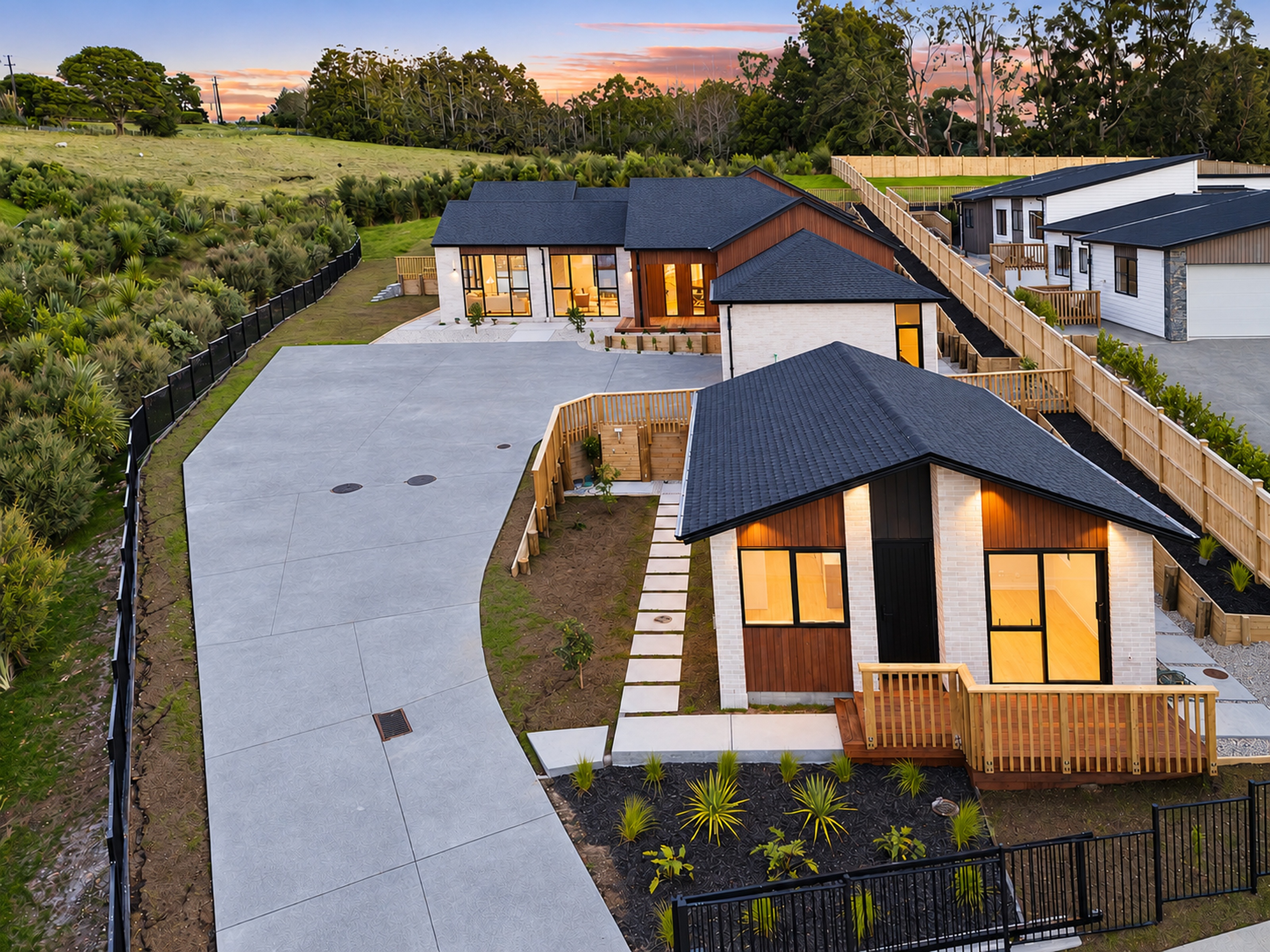 Elevated view of the two dwellings and their landscaped arrival court