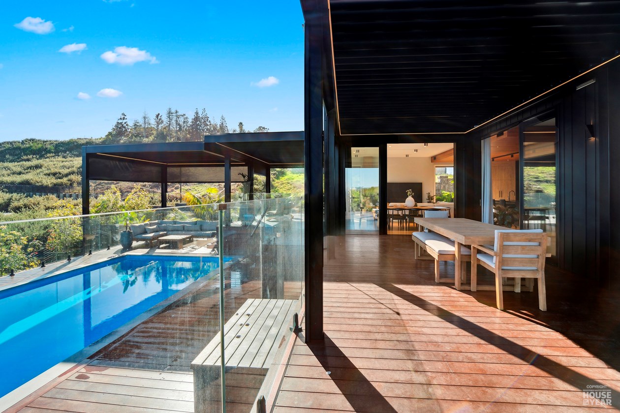 Outdoor dining room overlooking the Kewa Road home's pool