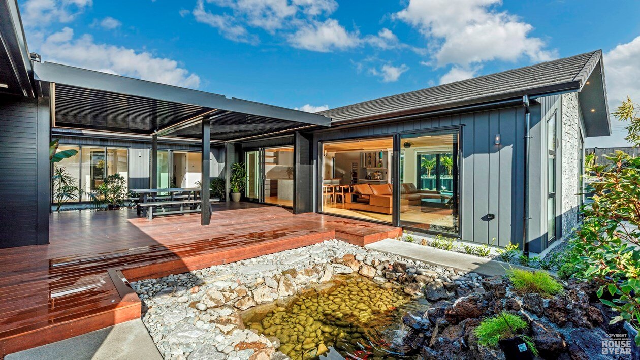 Outdoor living room and water feature at 44 Kewa Road