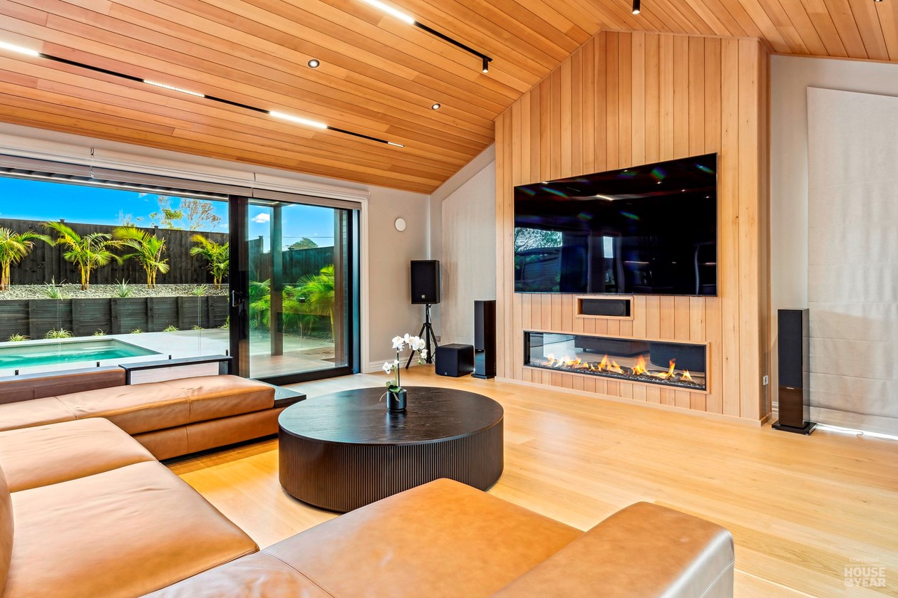 Family room opening to the covered terrace and pool at 44 Kewa Road