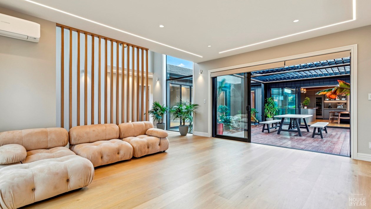 Timber-lined lounge overlooking the pool at 44 Kewa Road