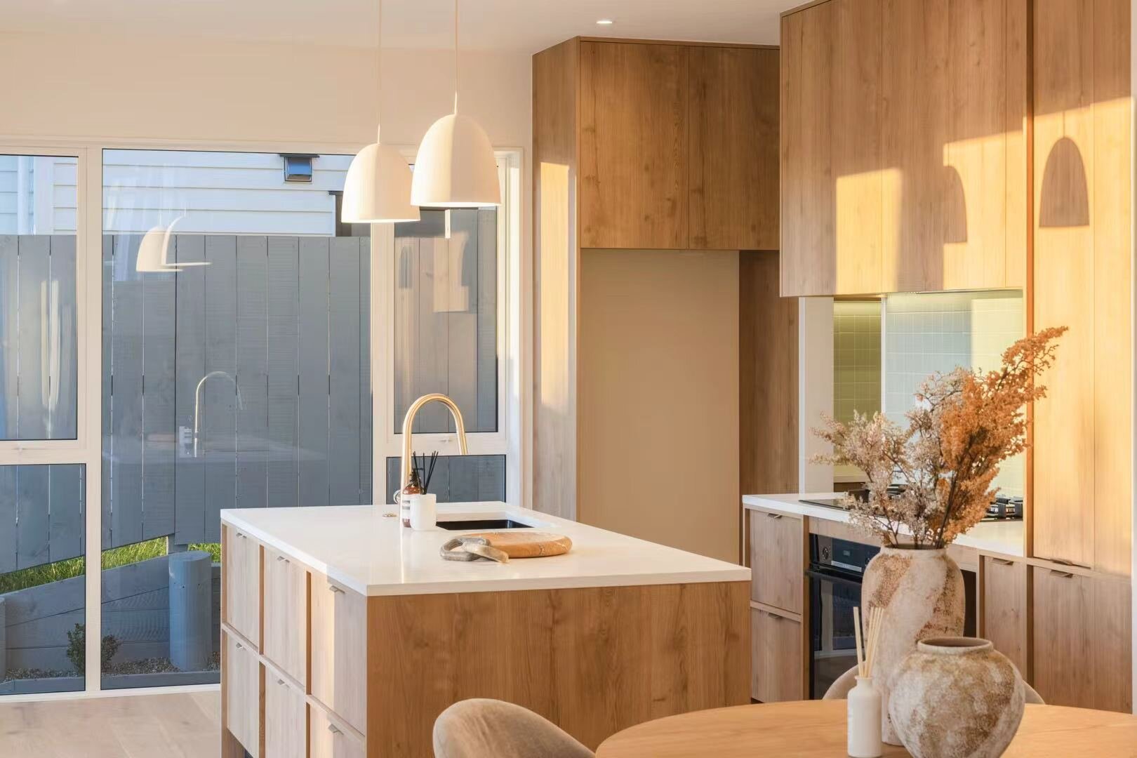 Kitchen with timber cabinetry and stone island